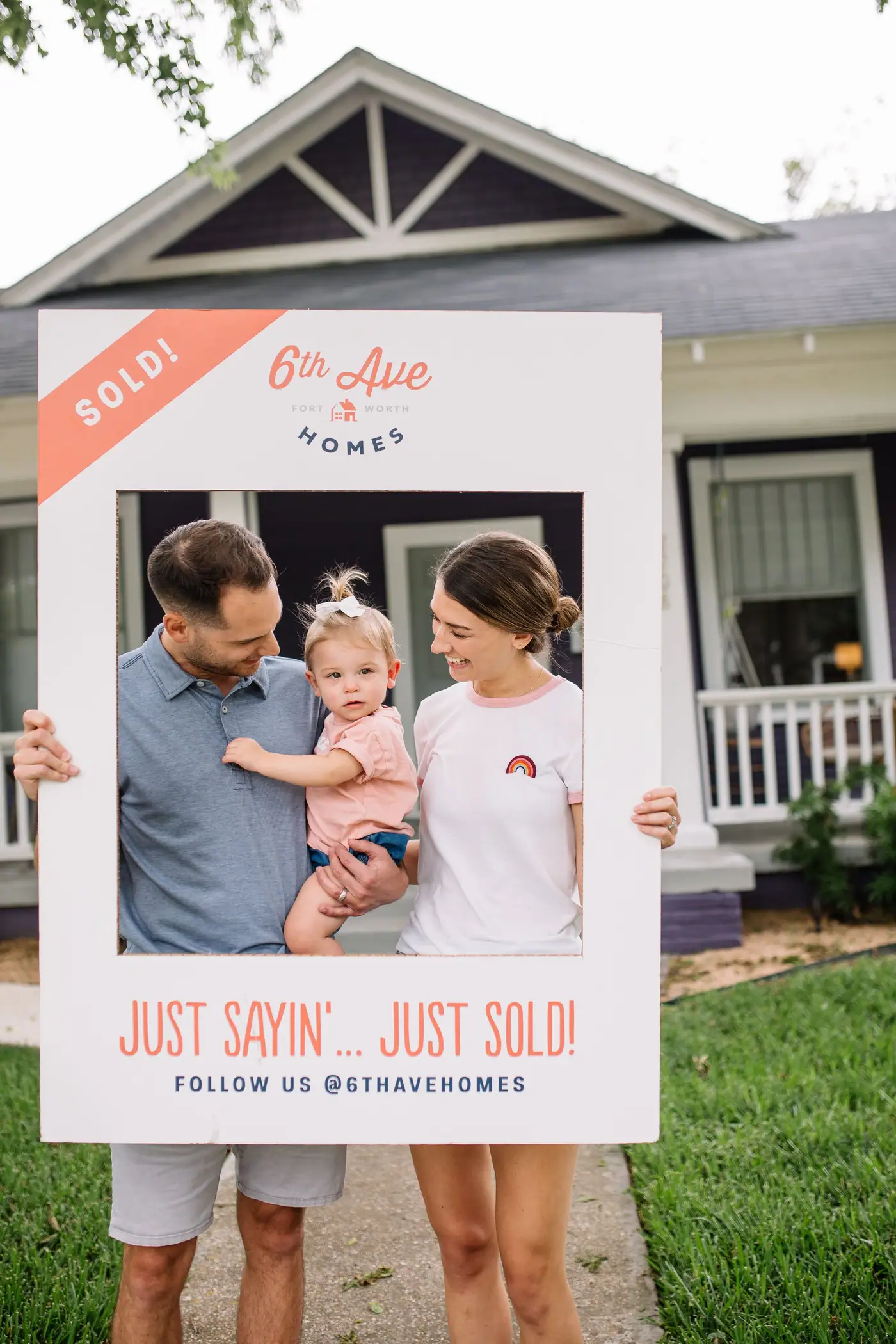 A 6th Ave Homes client family on closing day with their 'Just Sold' frame in Fort Worth