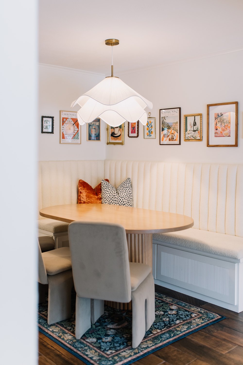 A characterful Fort Worth breakfast nook with a banquette and an art-filled gallery wall