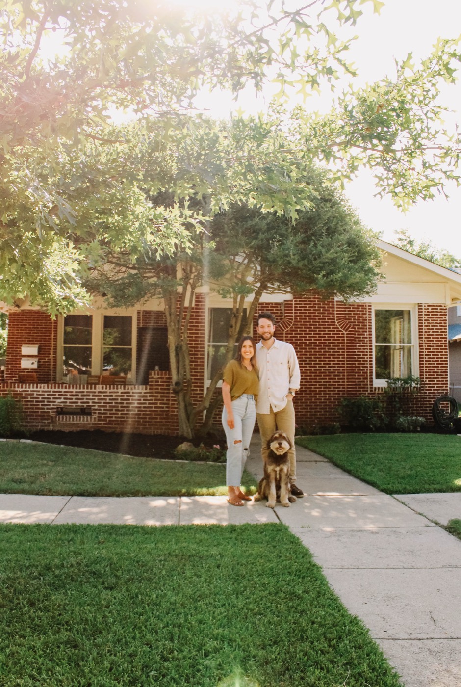 A Fort Worth couple in front of the brick home they bought with 6th Ave Homes