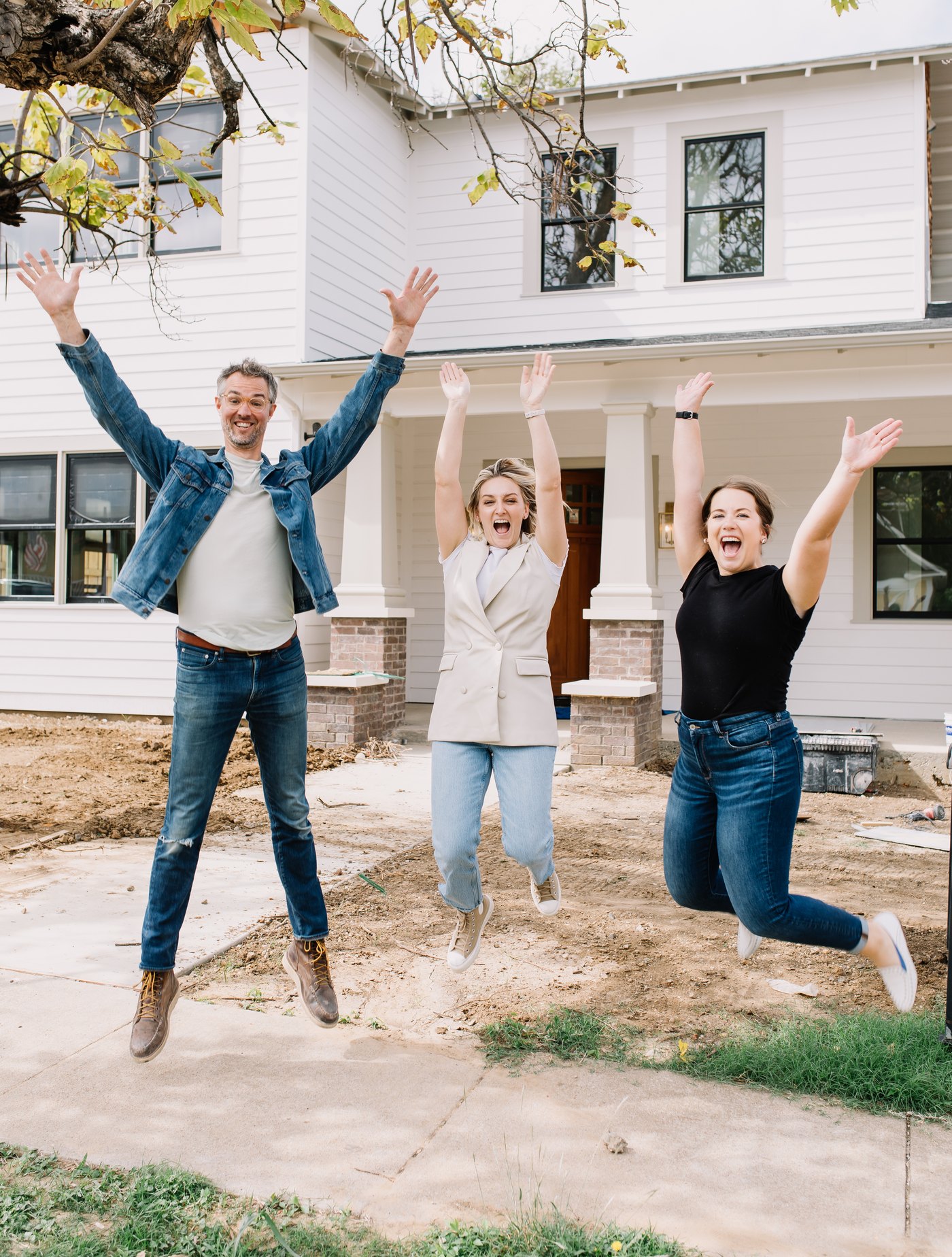 The 6th Ave Homes team celebrating outside a finished custom home in Fort Worth