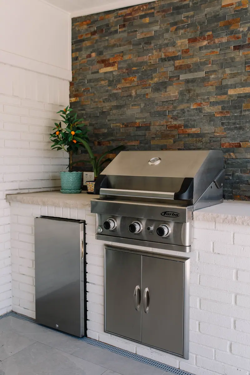 A grill standing alone against a wall