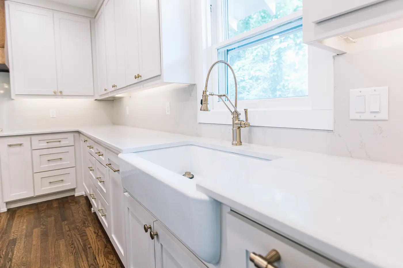 The farmhouse sink under the window, by 6th Ave Homes in Fort Worth